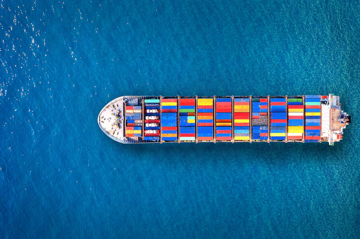 Large commercial ship sailing on open water under clear skies