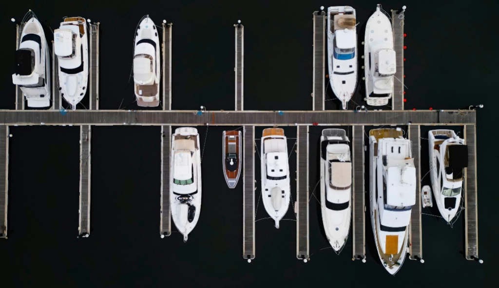 a dock filled with lots of boats next to each other.