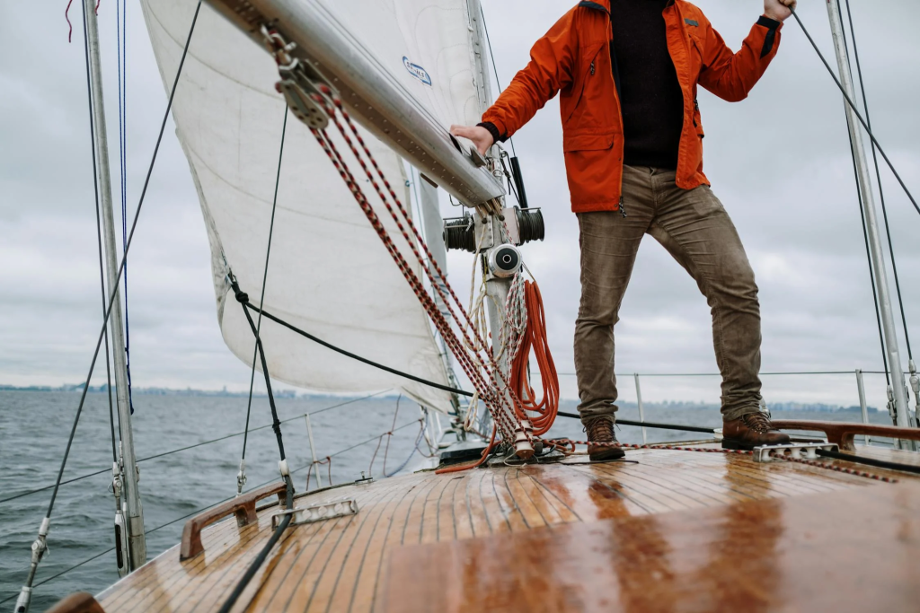 A man stands on a boat.