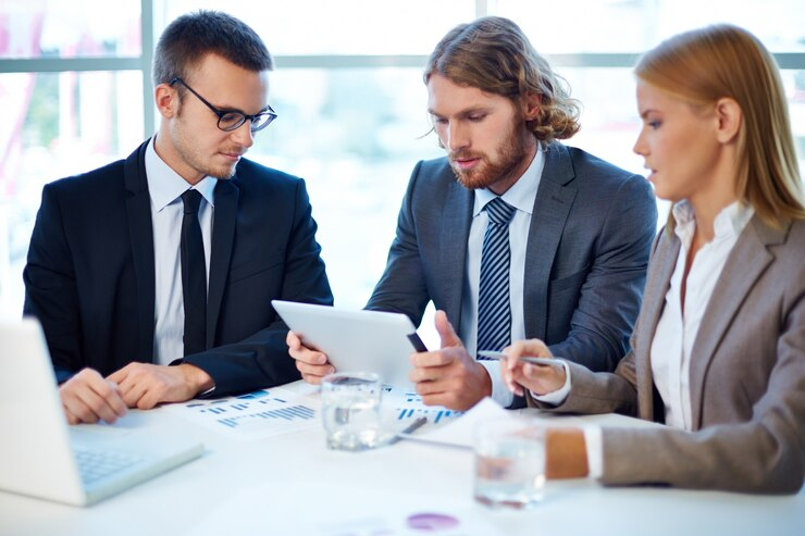 Marine consultant auditing compliance documents in a ship’s operations office
