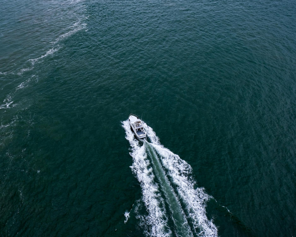 A commercial boat safely moves through the water.