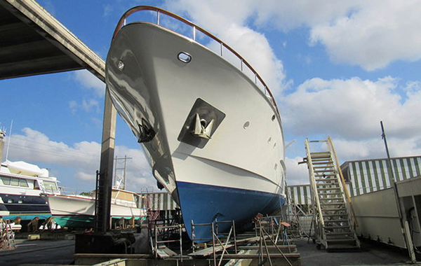 A large blue and white colored boat parked for inspection.