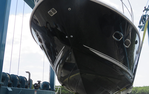 A large black colored boat ready for inspections.
