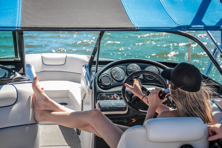 A woman steering a speedboat