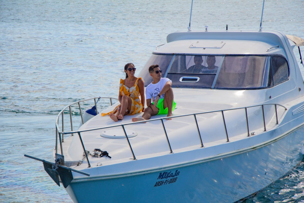 A couple sitting on a yacht’s deck