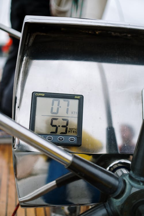 close-up of a digital equipment attached near a boat’s wheel