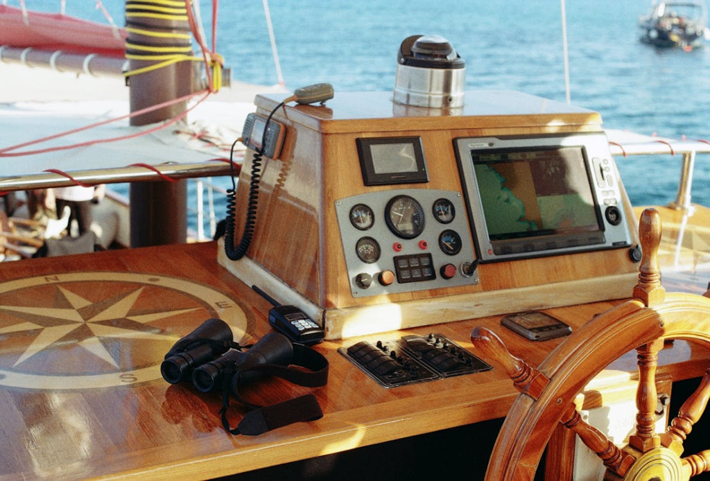 close-up of a captain's wheel on a boat with a screen for thermal imaging