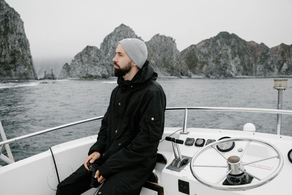 a man sitting on a boat